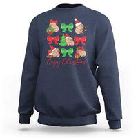 Navy crewneck sweatshirt with capybara Christmas graphic and red bows