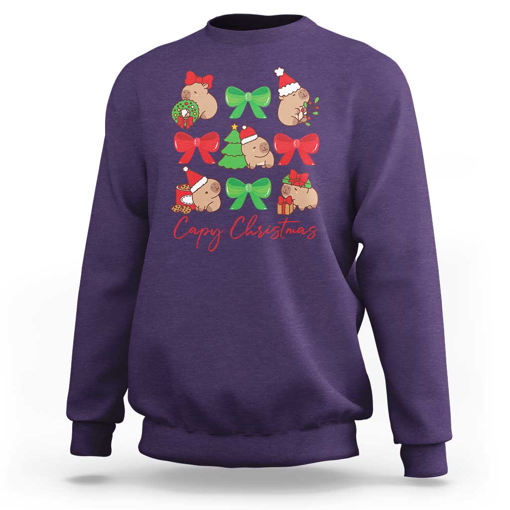 Purple crewneck sweatshirt with capybara Christmas graphic and red bows