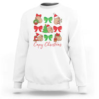 White crewneck sweatshirt with capybara Christmas graphic and red bows