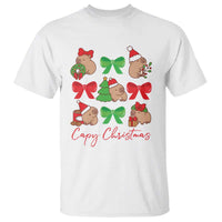 White capybara Christmas T-shirt with colorful bow wreath print and 'Capy Christmas' text