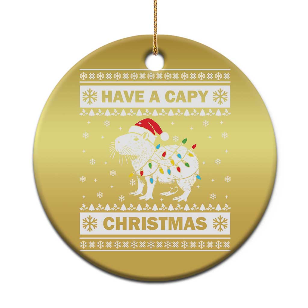 Gold round capybara Christmas ornament with “HAVE A CAPY” and “CHRISTMAS” text