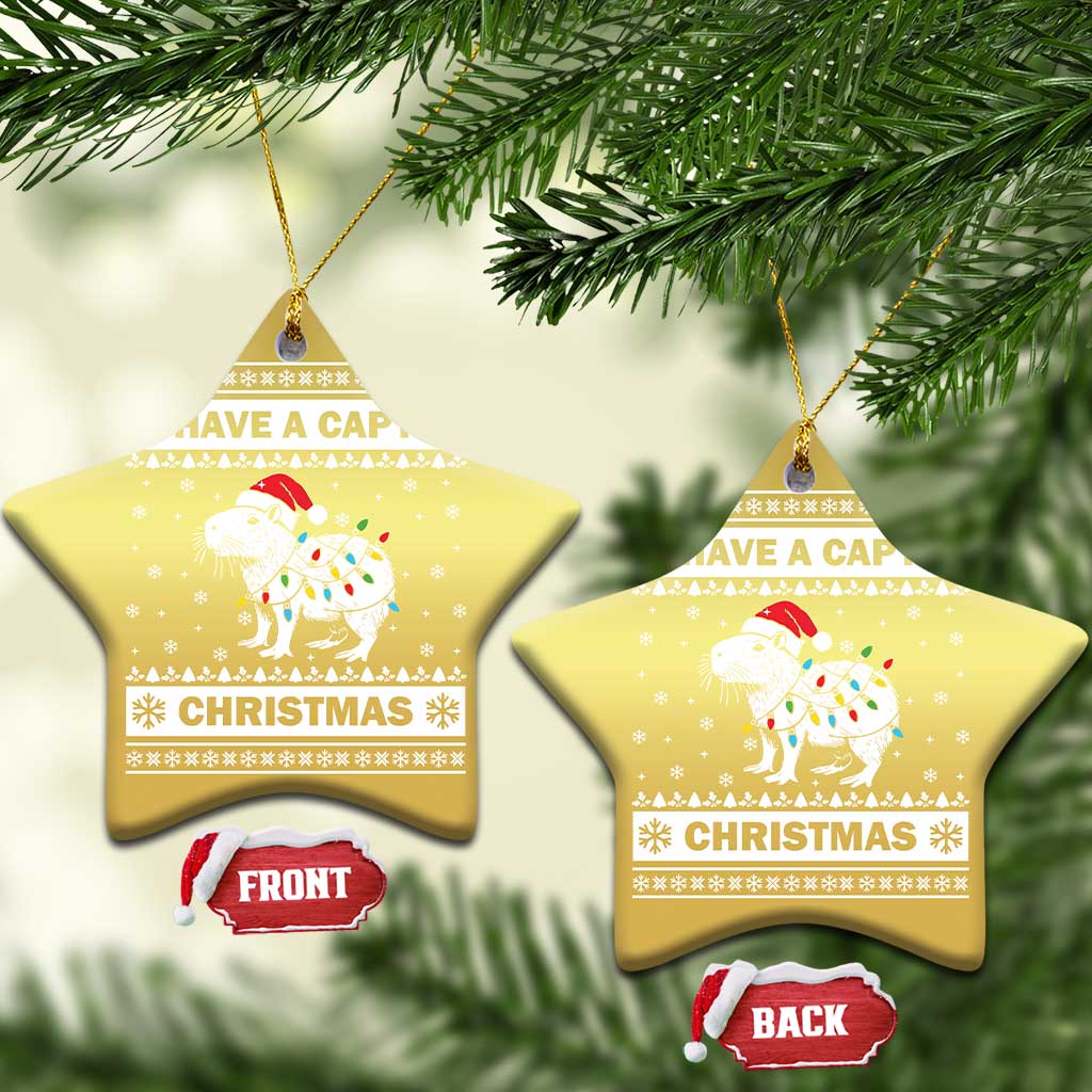 Gold star-shaped capybara Christmas ornament with “HAVE A CAPY” and “CHRISTMAS”