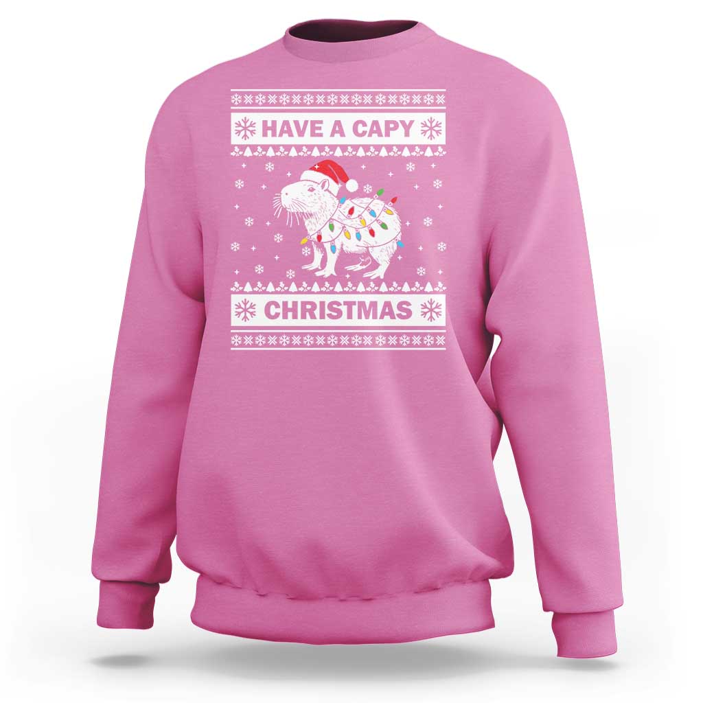 Azalea pink Christmas sweatshirt with capybara graphic and 'Have a Capy Christmas' text.