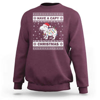 Maroon Christmas sweatshirt with capybara graphic and 'Have a Capy Christmas' text.