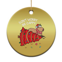 Gold round capybara Xmas ornament with red outfit and 'DON'T WORRY BE CAPPY' text