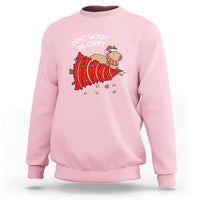 Light pink Christmas capybara sweatshirt with “Don’t Worry Be Capy” graphic on chest