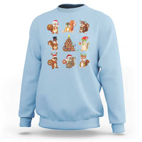 Light blue Christmas sweatshirt with cartoon Santa, reindeer, and animal characters graphic