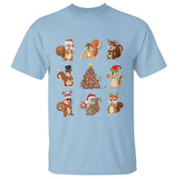 Light blue Christmas graphic T-shirt with cartoon squirrel Santa and reindeer design.