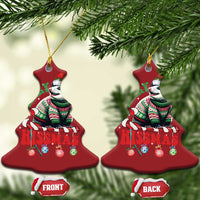 Two red bell-shaped opossum Christmas ornaments with gold hanging cords