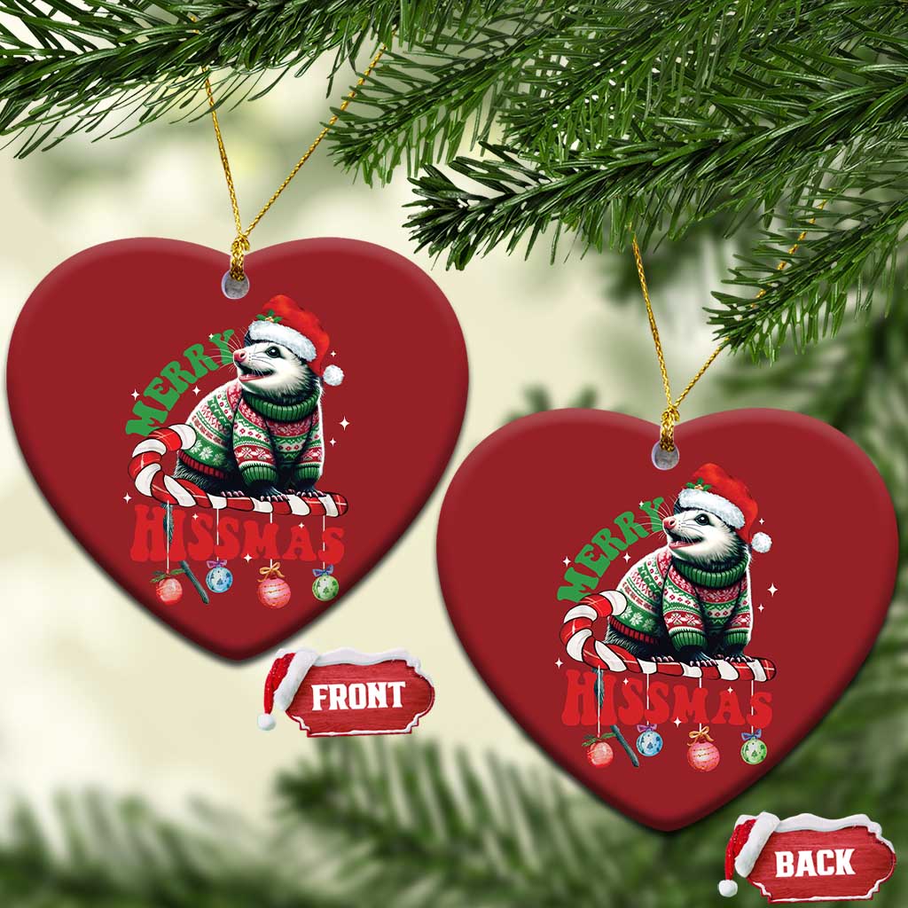 Two red heart-shaped opossum Christmas ornaments hanging from gold cords