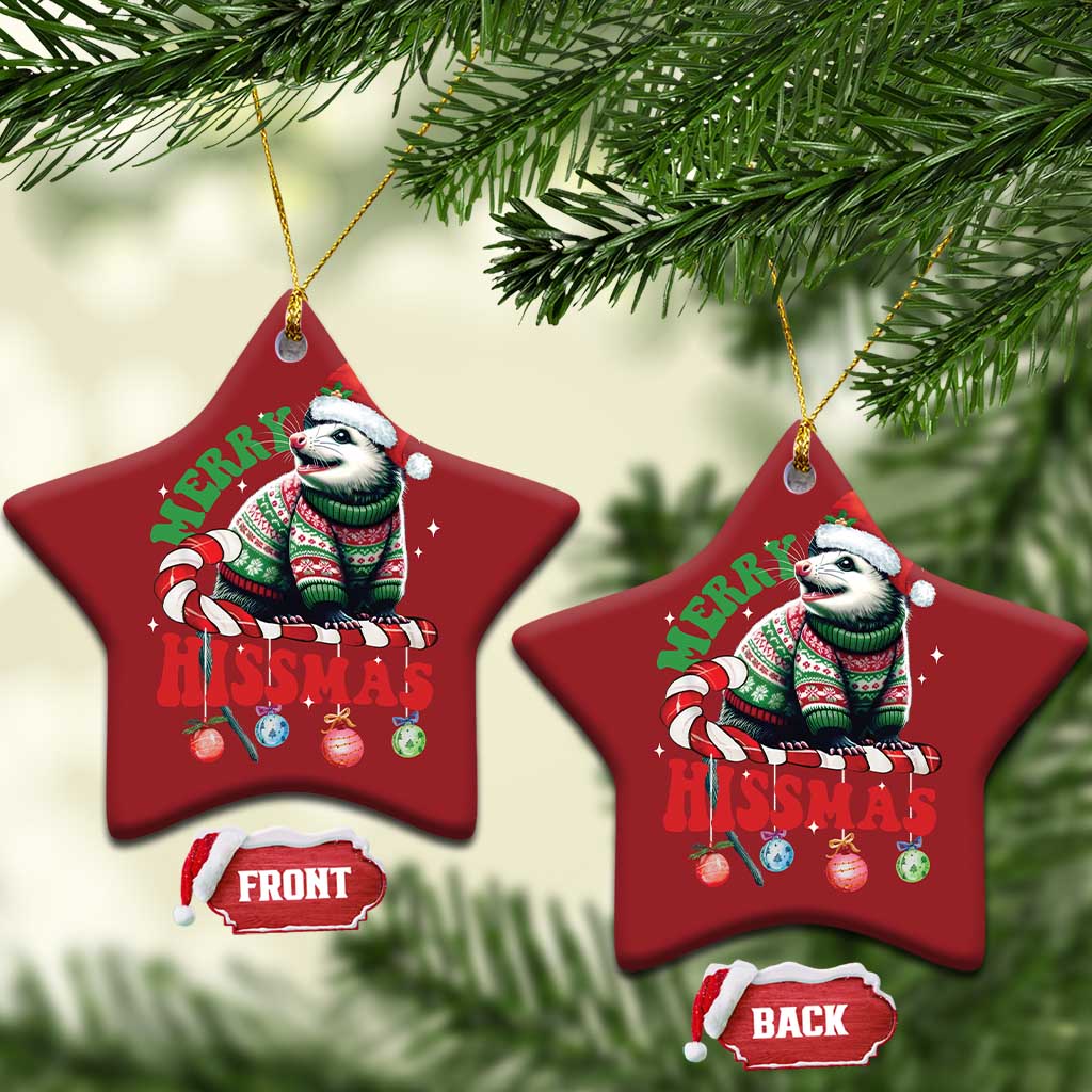 Two red tree-shaped opossum Christmas ornaments hanging from gold cords