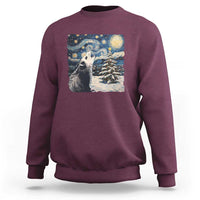 Maroon crewneck sweatshirt with opossum night-sky graphic and starry landscape print