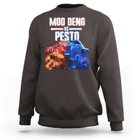 Dark brown crewneck sweatshirt with colorful “MOO DENG VS PESTO” graphic on chest
