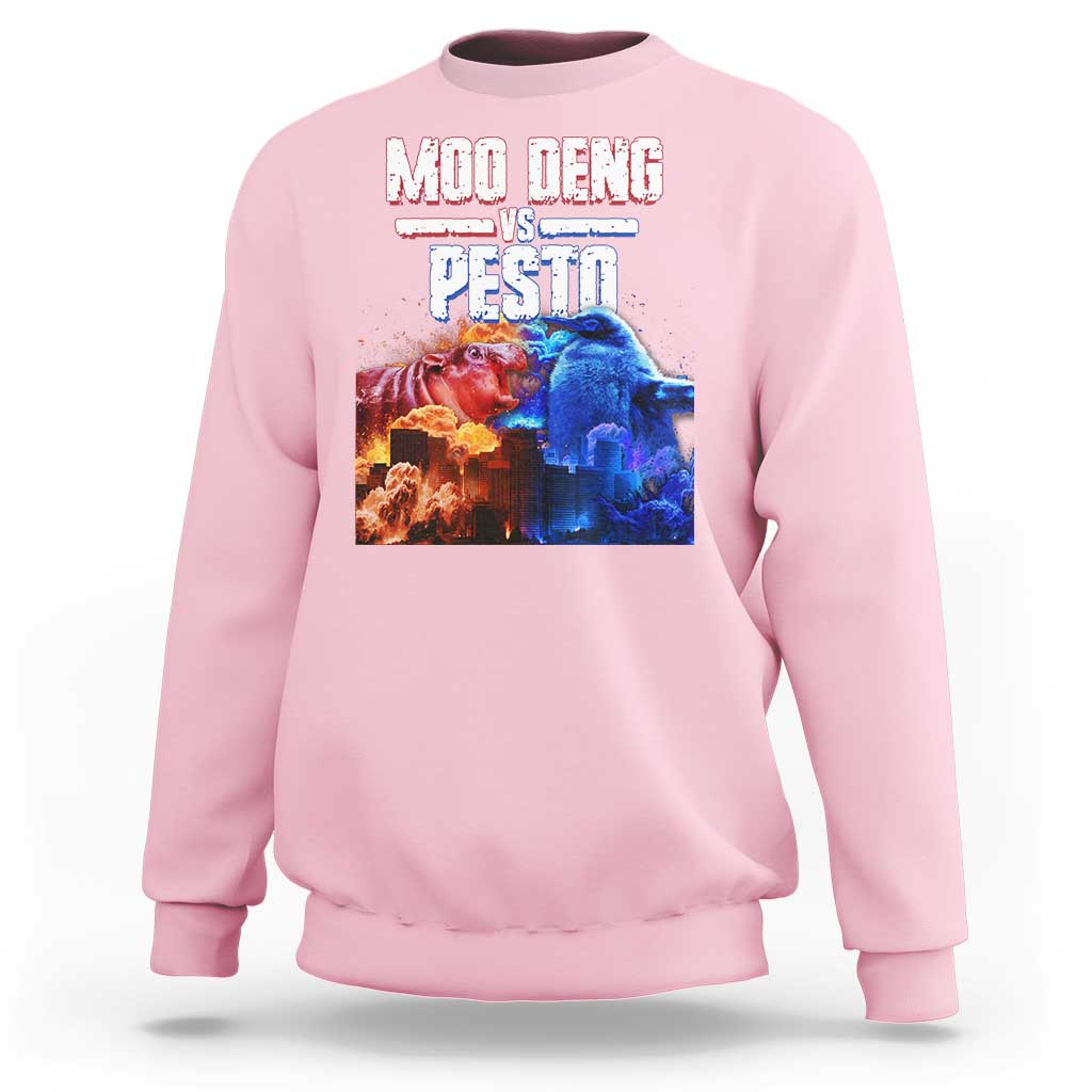 Light pink crewneck sweatshirt with colorful “MOO DENG VS PESTO” graphic on chest