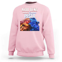 Light pink crewneck sweatshirt with colorful “MOO DENG VS PESTO” graphic on chest