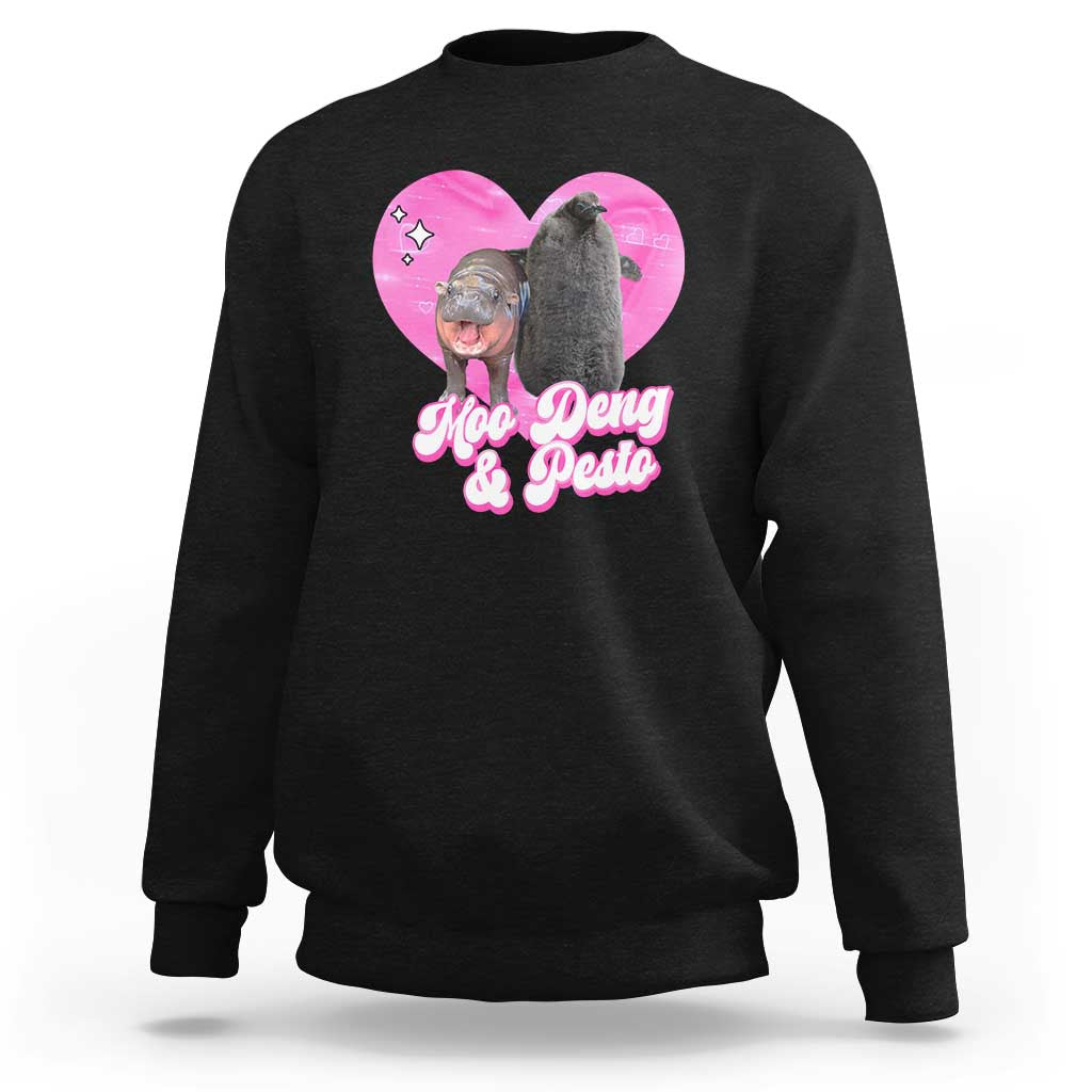 Black graphic sweatshirt with pink heart logo and Moo Deng & Pesto text