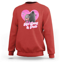 Red graphic sweatshirt with pink heart logo and Moo Deng & Pesto text