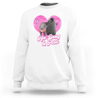 White graphic sweatshirt with pink heart logo and Moo Deng & Pesto text