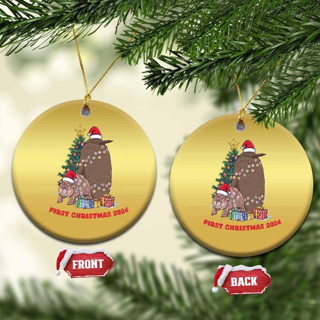 Two gold round Christmas ornaments hanging, 'First Christmas 2024' text on both sides