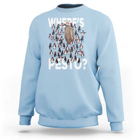 Light blue crewneck sweatshirt with “WHERE’S PESTO?” graphic and penguin pattern on front.