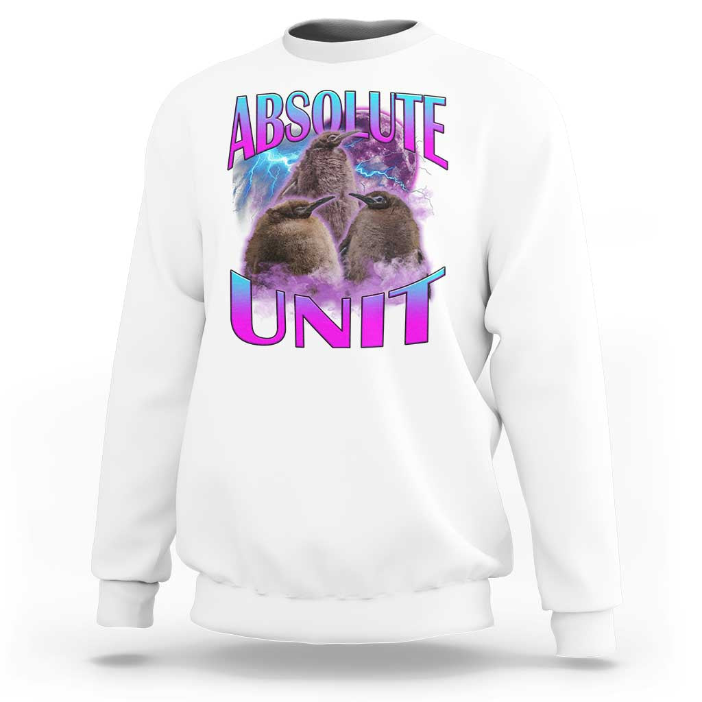 White crewneck sweatshirt with penguin graphic and “ABSOLUTE UNIT” print on chest.