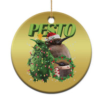 Gold circle Christmas ornament with green PESTO text and a penguin holding a wreath