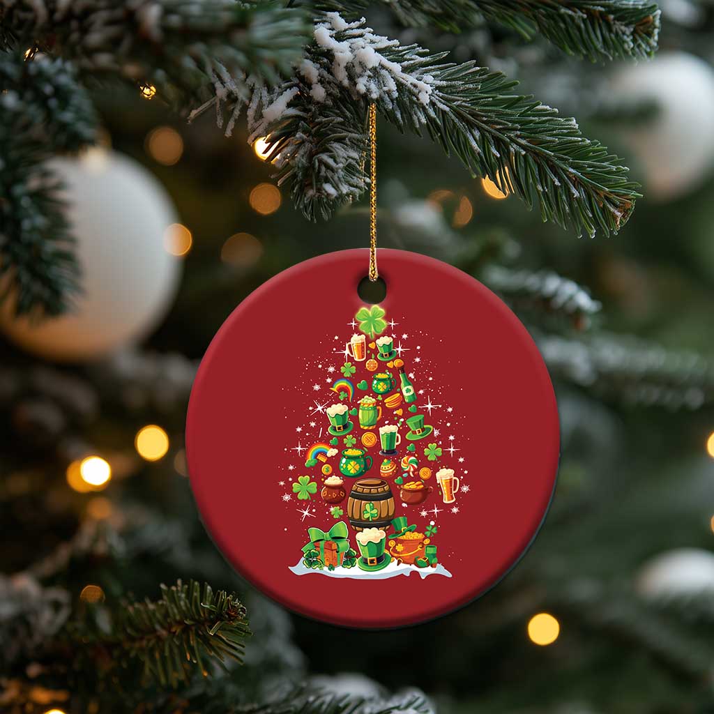 Red round Irish Christmas ornament hanging with illustrated Christmas tree, candles, and shamrocks.