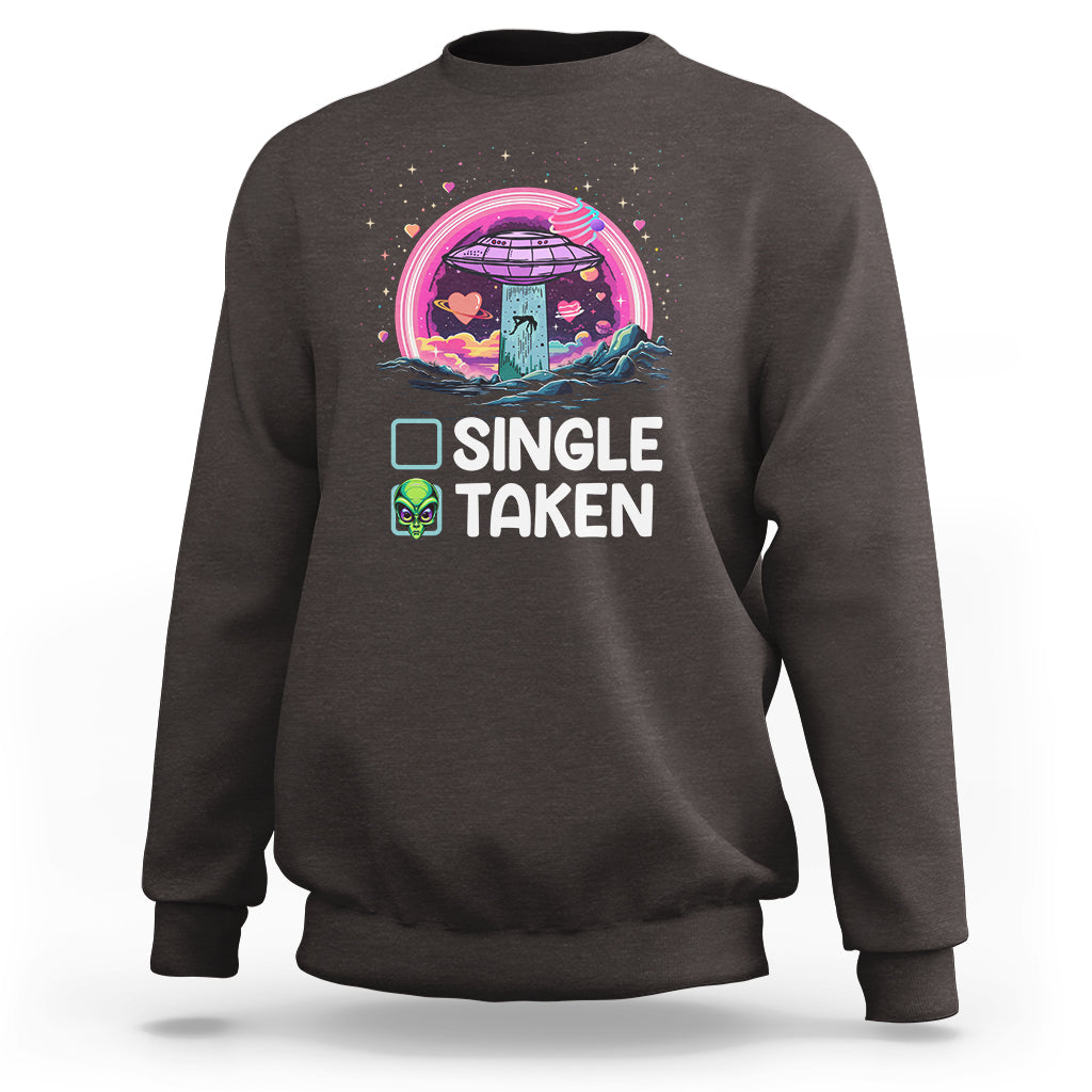 Dark chocolate crewneck sweatshirt with 'SINGLE TAKEN' alien UFO Valentine graphic