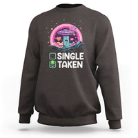 Dark chocolate crewneck sweatshirt with 'SINGLE TAKEN' alien UFO Valentine graphic