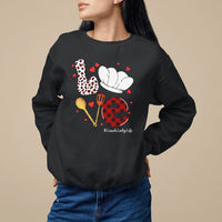 Women's black sweatshirt with lunch-themed graphic and hearts, hashtag #LunchLadyLife