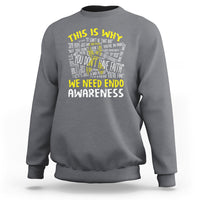 Charcoal gray sweatshirt with “We Need Endometriosis Awareness” back graphic, crew neck.