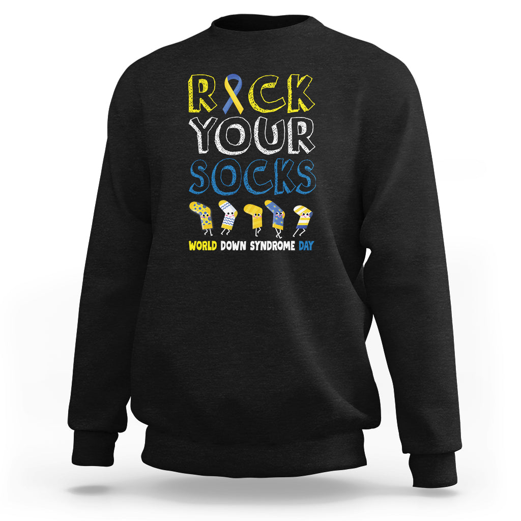 Black crewneck sweatshirt with “Rock Your Socks” text and colorful sock character graphic