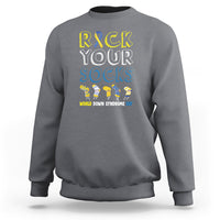 Charcoal gray crewneck sweatshirt with “Rock Your Socks” text and colorful sock character graphic