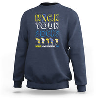 Navy crewneck sweatshirt with “Rock Your Socks” text and colorful sock character graphic