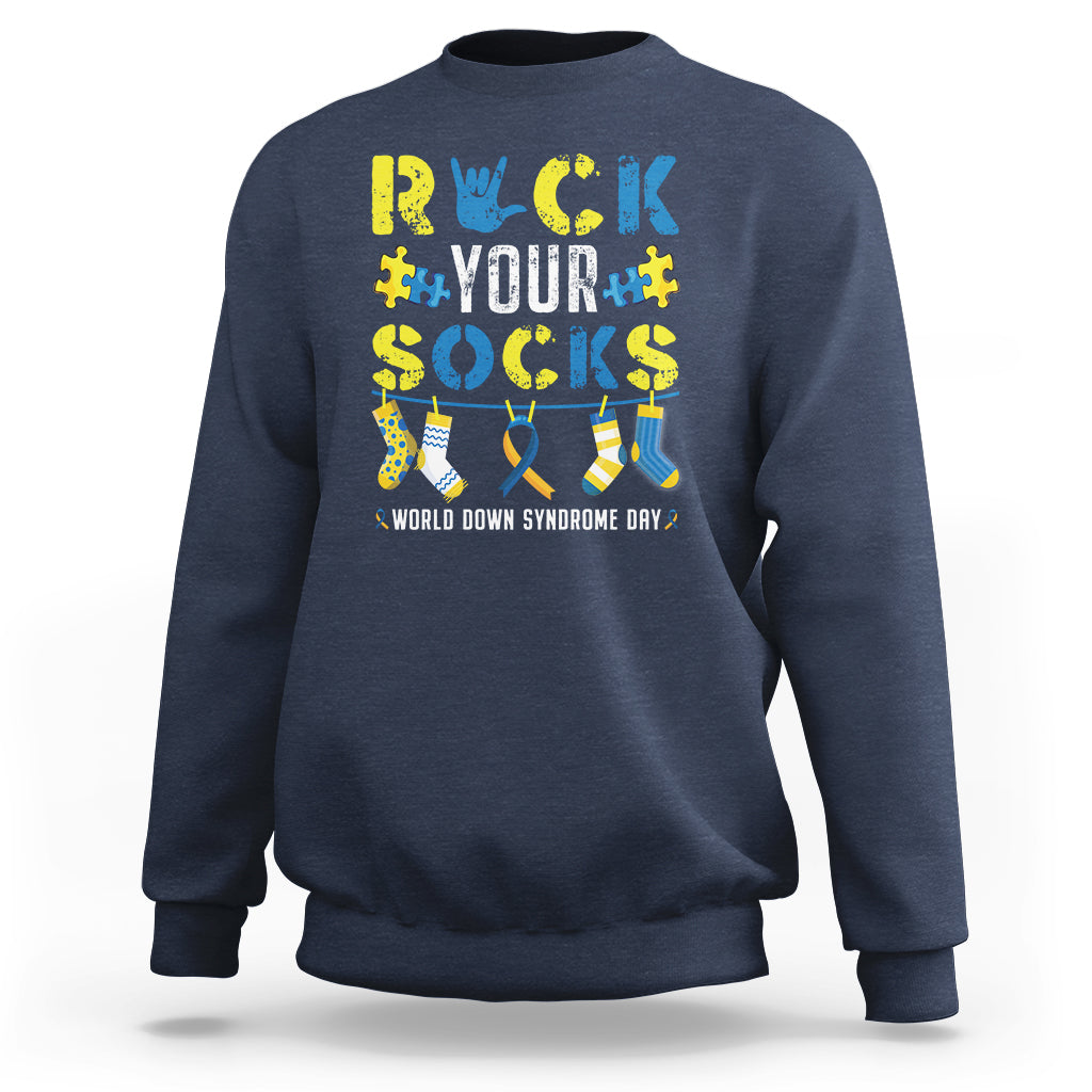 Navy crewneck sweatshirt with colorful “Rock Your Socks” sock graphic on back
