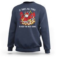 Navy crewneck sweatshirt with colorful music-themed graphic and slogan on chest.