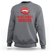 Charcoal crewneck sweatshirt with red vampire lip graphic and “BLOOD DONORS NEEDED” print