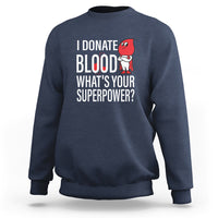 Navy crewneck sweatshirt with front print: “I Donate Blood What’s Your Superpower?”