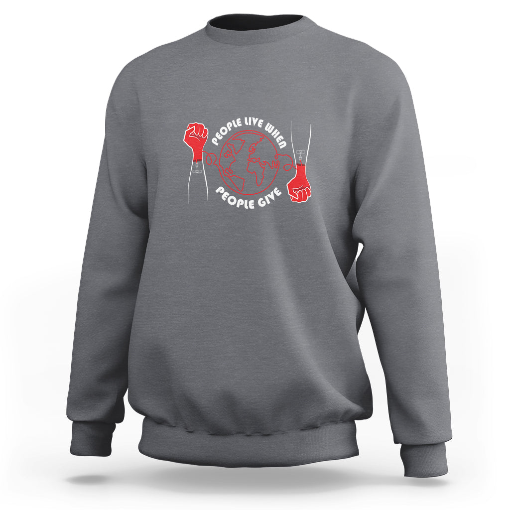 Charcoal gray crewneck sweatshirt with red heart donor graphic on the front