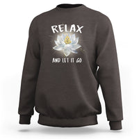 Charcoal gray sweatshirt with “RELAX” and lotus graphic on the back