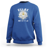 Royal blue sweatshirt with “RELAX” and lotus graphic on the back