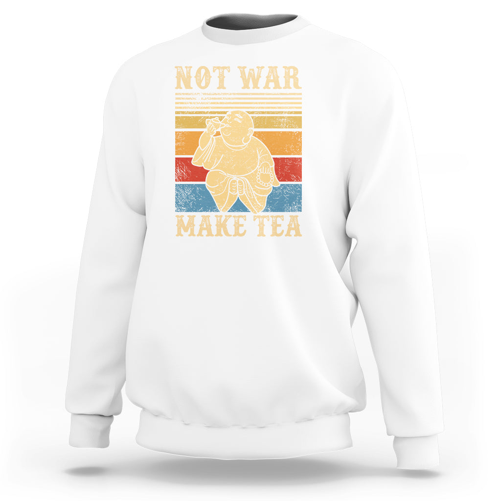White crewneck sweatshirt with Buddha graphic and 'NOT WAR MAKE TEA' text.