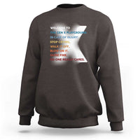 Dark brown crewneck sweatshirt with colorful back slogan print