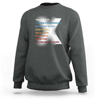 Charcoal gray crewneck sweatshirt with colorful back slogan print