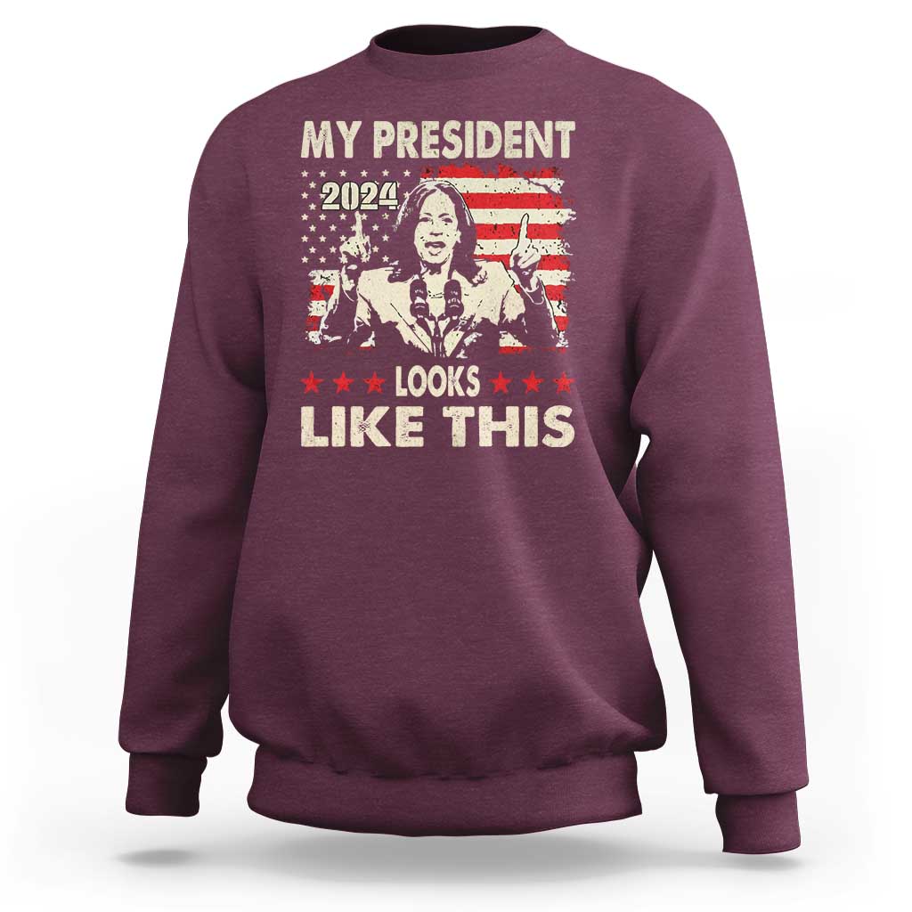 Maroon crewneck sweatshirt with bold graphic text "MY PRESIDENT LOOKS LIKE THIS"
