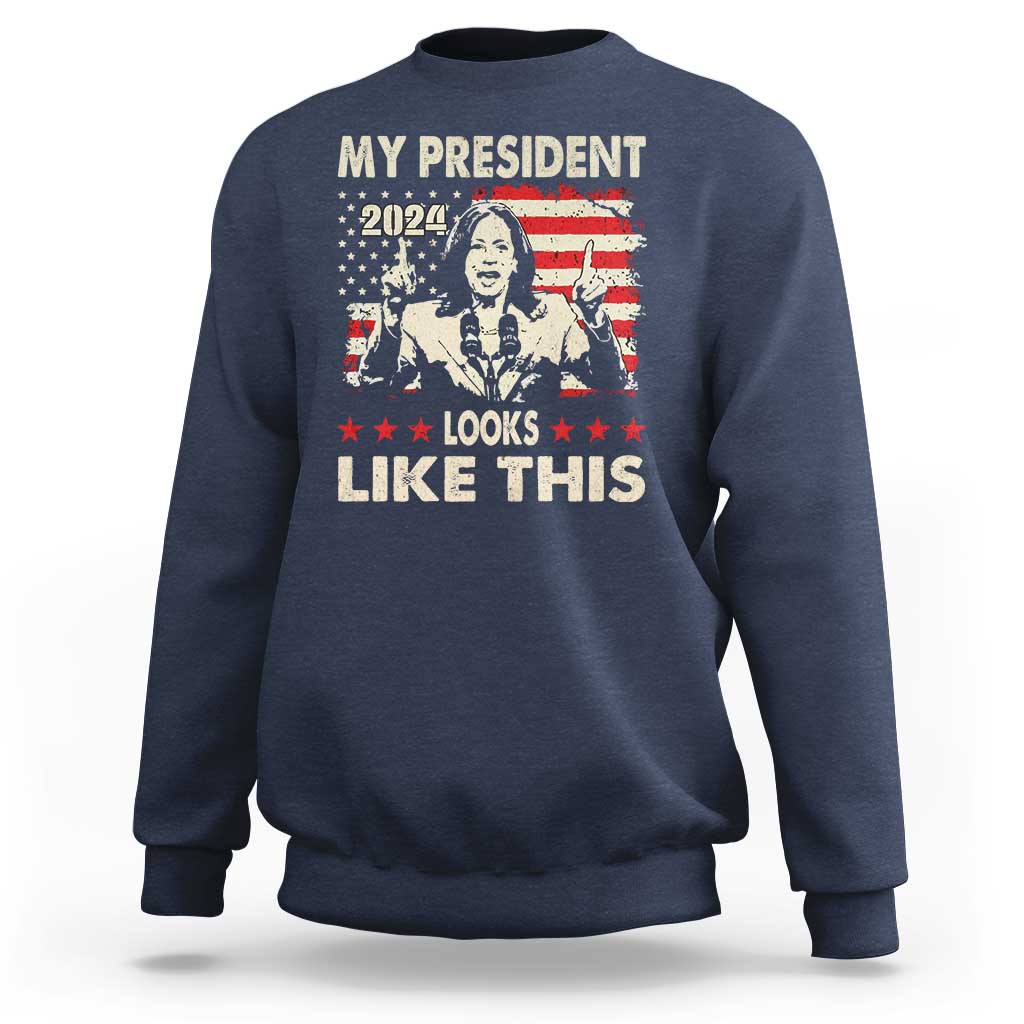 Navy crewneck sweatshirt with bold graphic text "MY PRESIDENT LOOKS LIKE THIS"