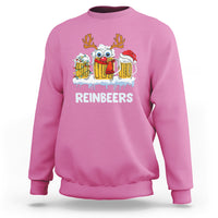 Azalea pink crewneck sweatshirt with reindeer holding beer mugs graphic on chest