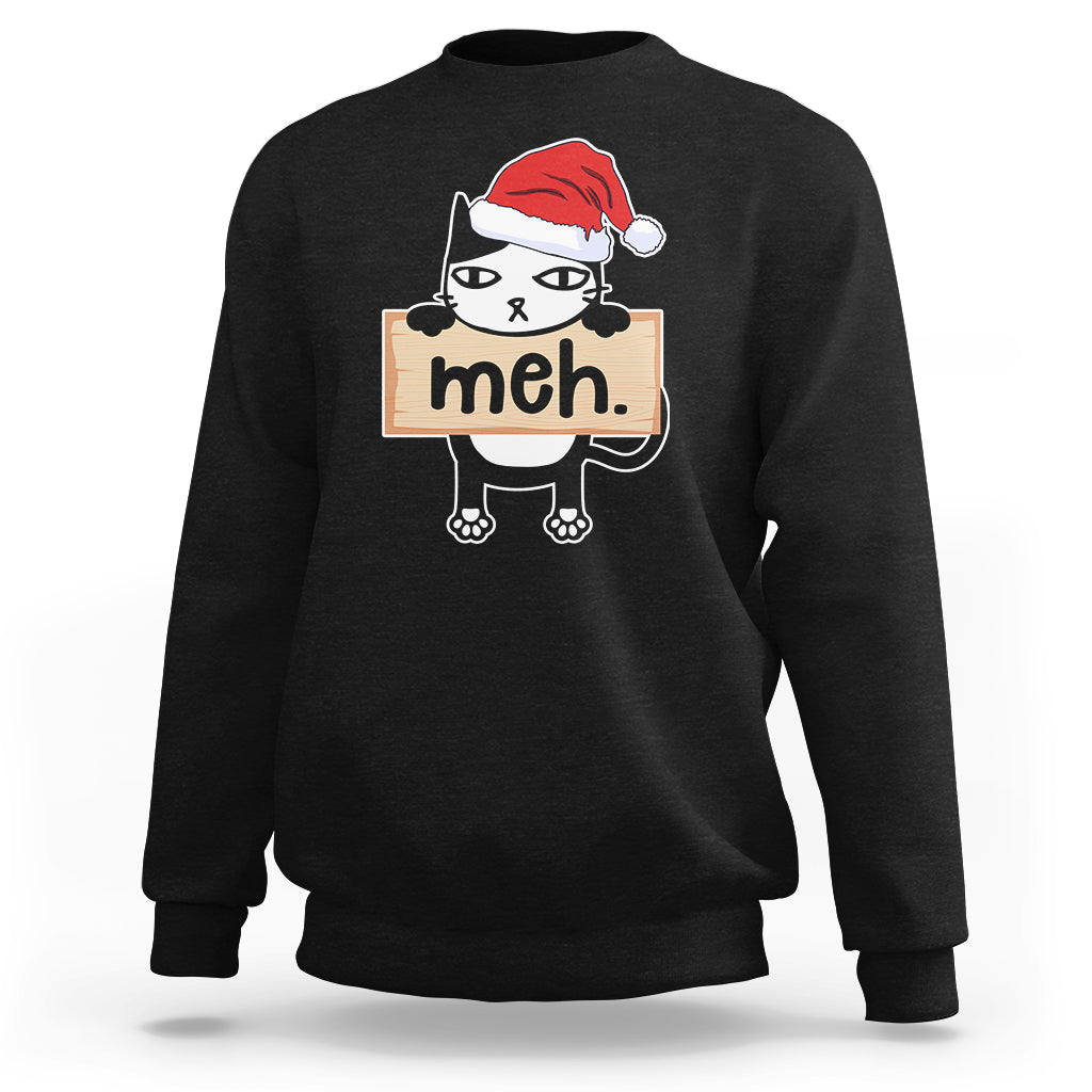 Black sweatshirt with cartoon black cat wearing Santa hat and “meh” sign front print.