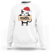 White sweatshirt with cartoon black cat wearing Santa hat and “meh” sign front print.