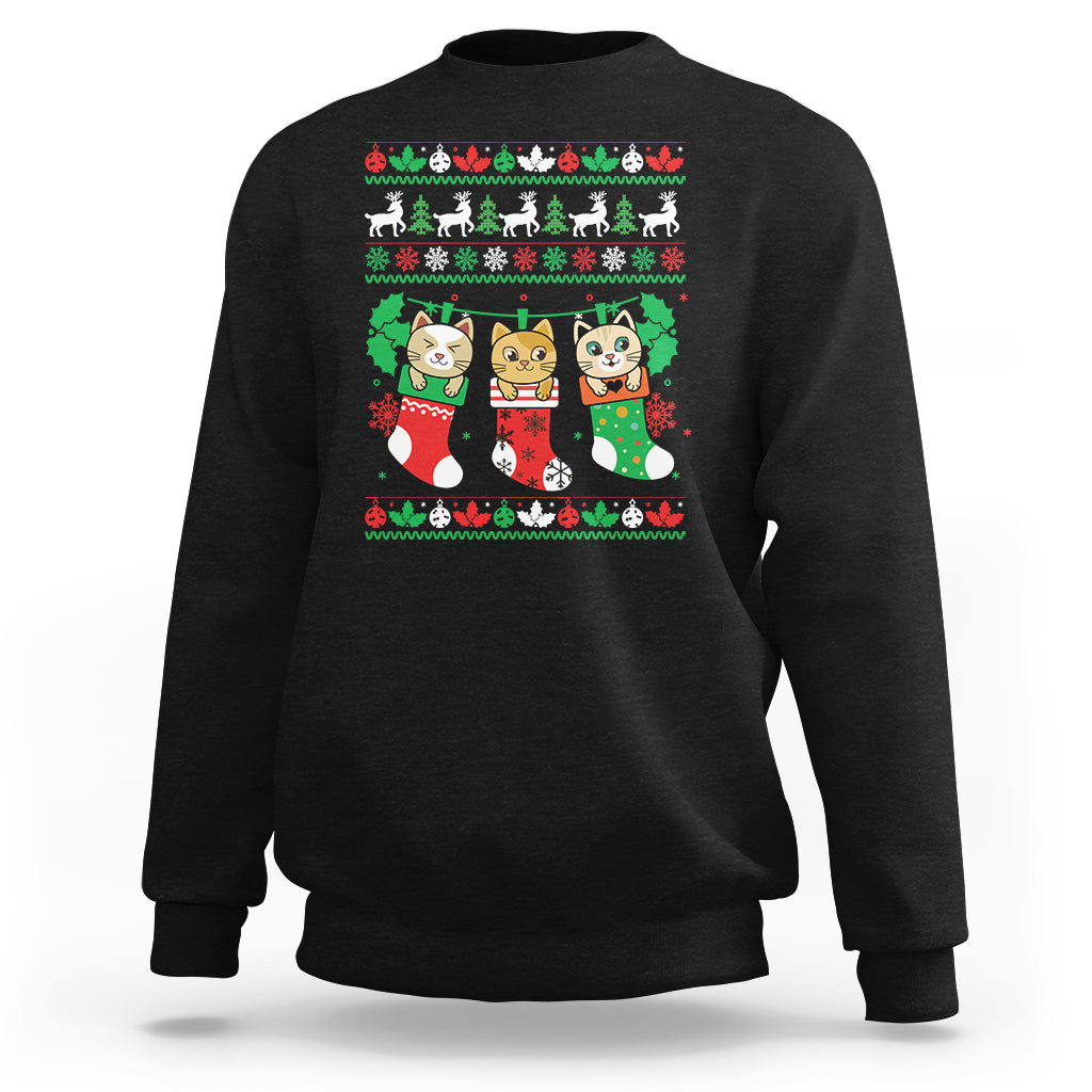 Black crewneck sweatshirt with cute cat-in-socks Christmas graphic.
